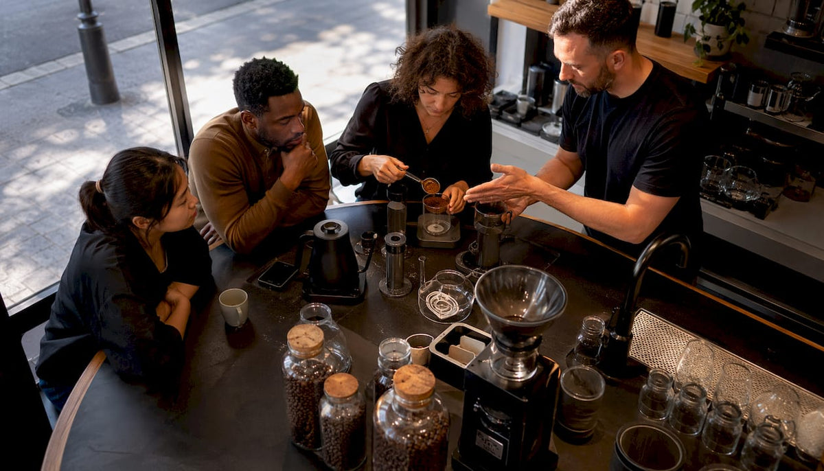 Participants in hands-on coffee brewing workshop