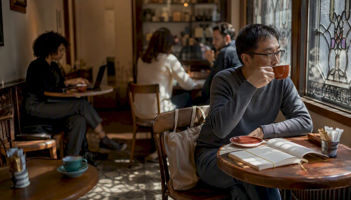 Busy coffee shop with patrons seated considerately