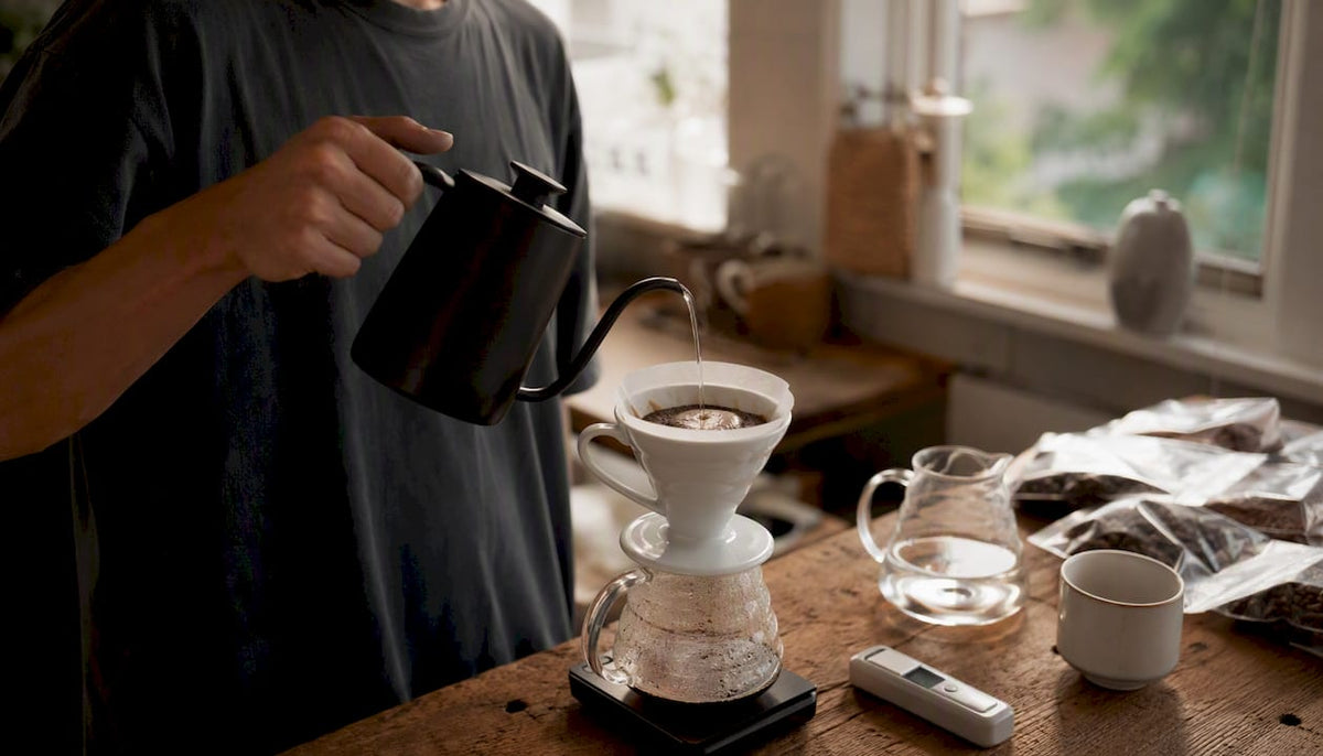 Pour-over coffee brewing with focus on water pouring